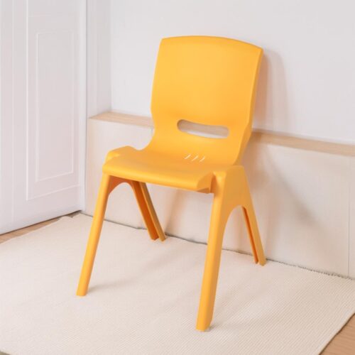 a yellow plastic chair leaning against a wall