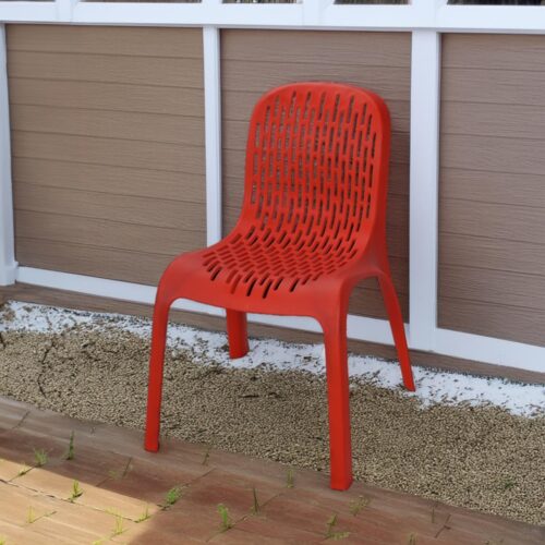 a red plastic chair on a patio